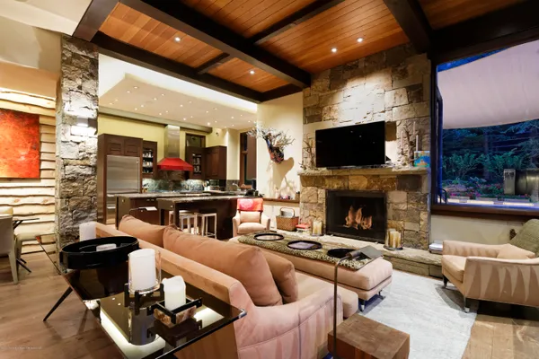 a living room with furniture fireplace and a flat screen tv