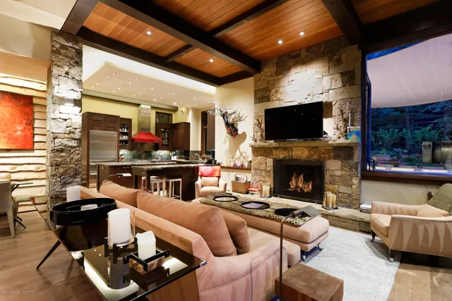 a living room with furniture fireplace and a flat screen tv