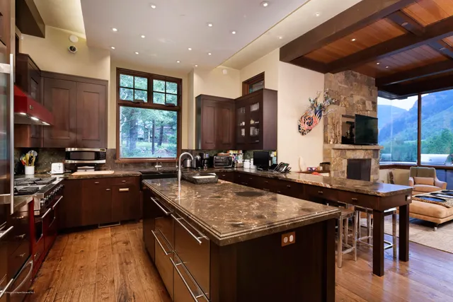 a bedroom with a bed and a fireplace