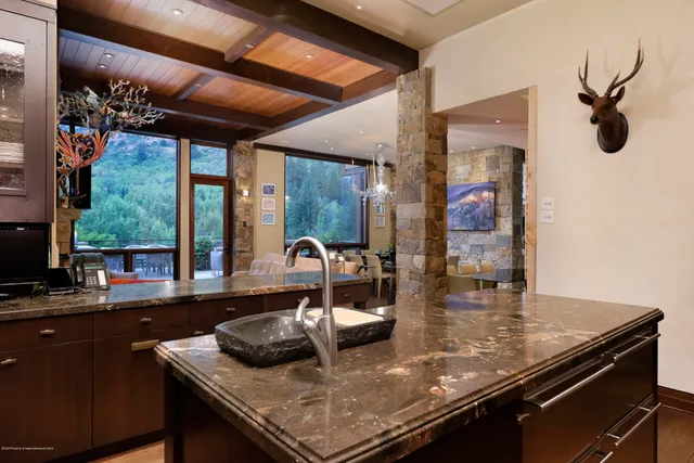 a bedroom with a large bed and a large window