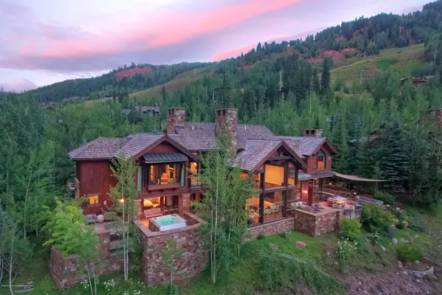 a view of a house with a mountain in the background