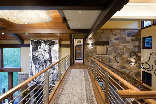 a bedroom with a large bed and a large window