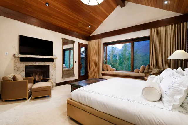 a bathroom with a sink and mirror with toilet