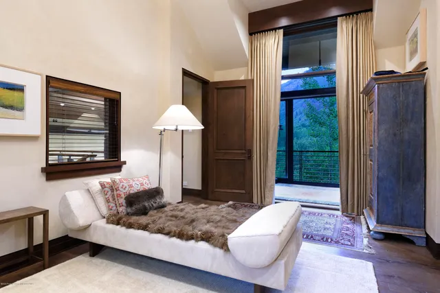 a front view of building with lot of trees