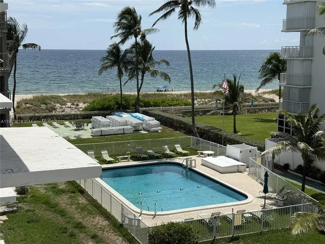 a view of a swimming pool with a lounge chairs