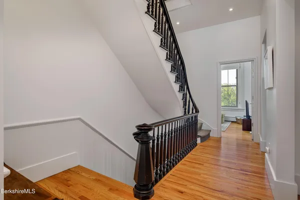 a view of entryway with wooden floor