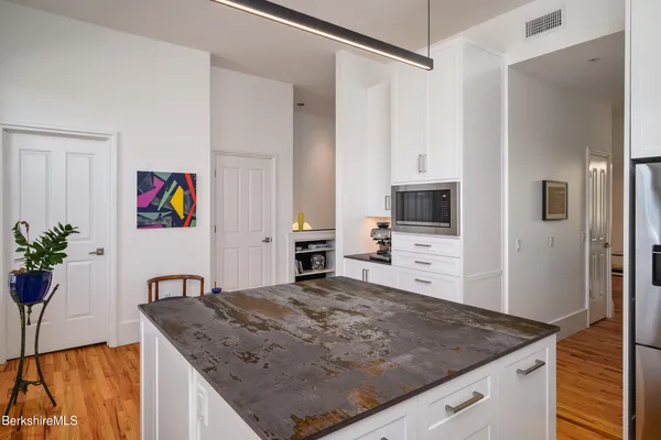 a view of a kitchen cabinets and a counter place