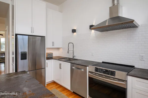 a kitchen with a sink and a stove