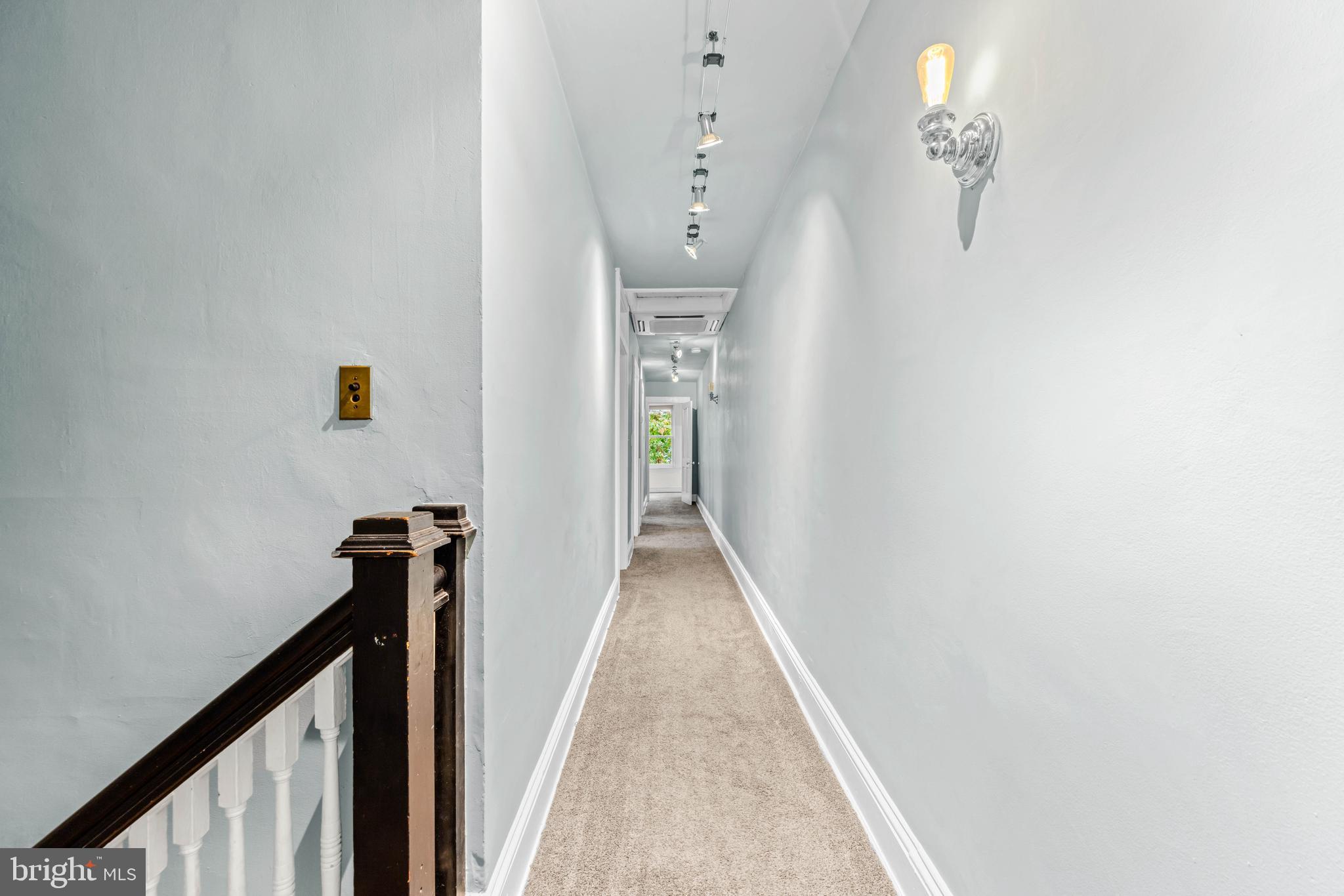 4016 Roland Avenue Baltimore, MD 21211 - Photo 42 of 54 Main Staircase to upstairs hallway