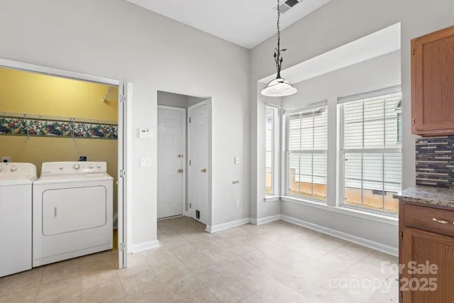 a view of livingroom with washer and dryer