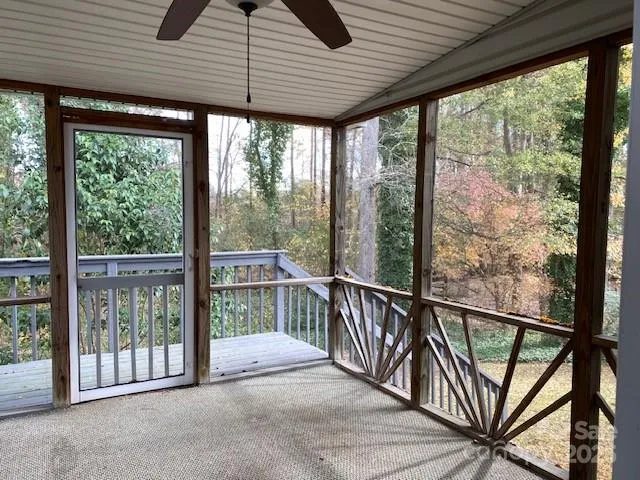 a view of a porch with wooden floor and stairs