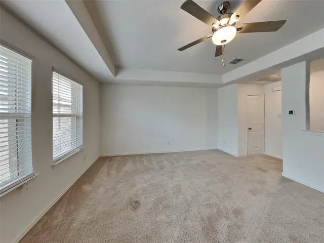 a view of an empty room with a window