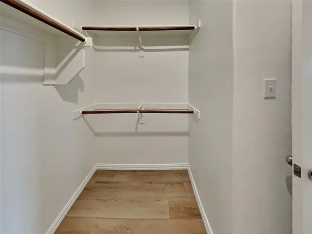 a view of an empty walk in closet