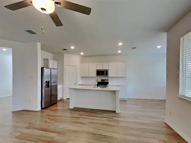a view of kitchen with wooden floor