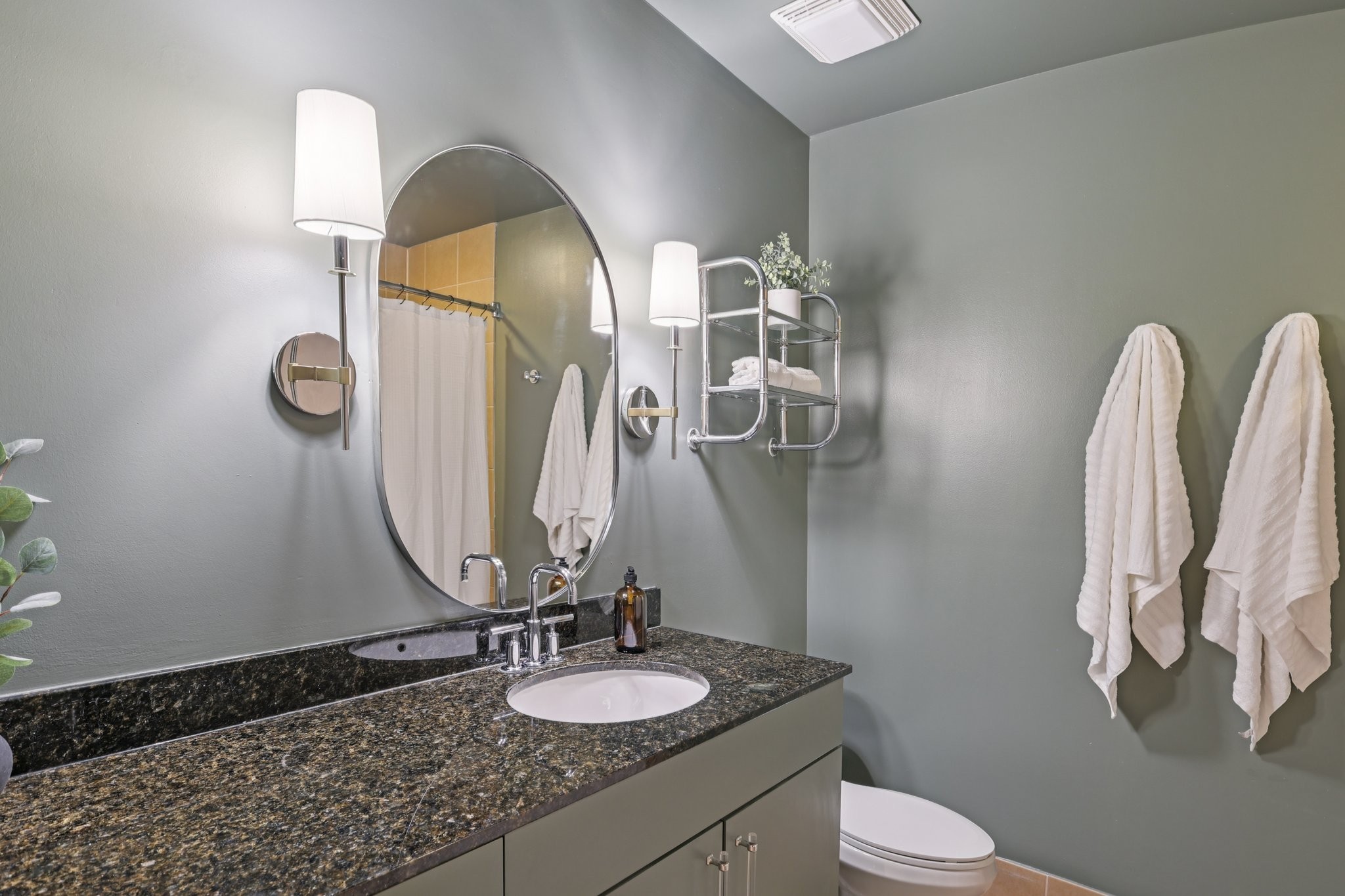 1101 18th Avenue South, Unit 401 Nashville, TN 37212 - Photo 12 of 17 a bathroom with a granite countertop sink and a mirror
