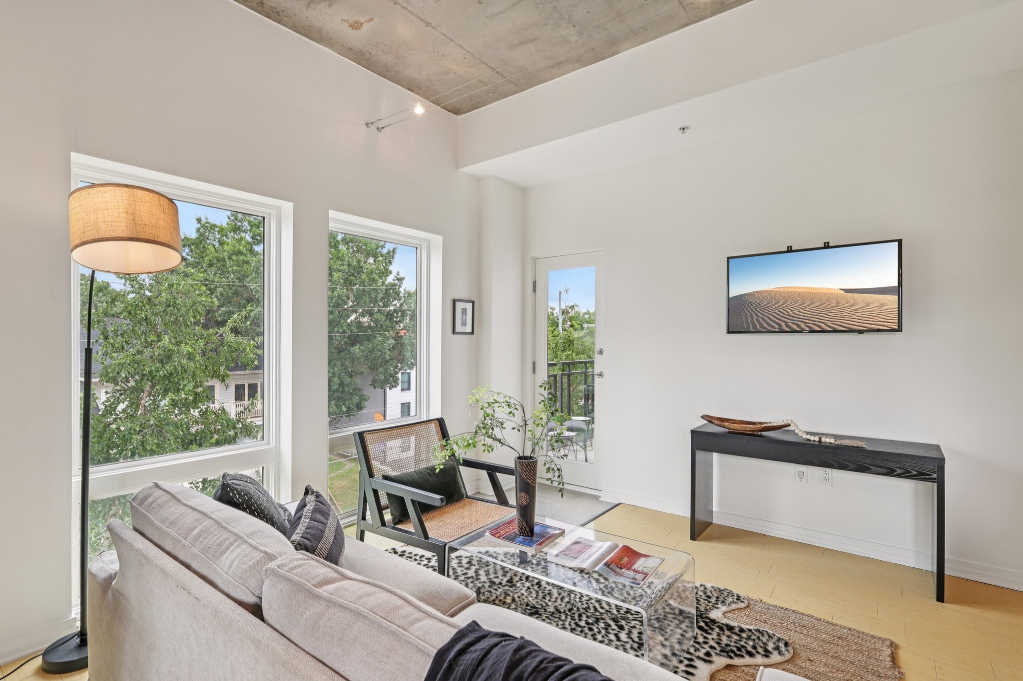 1101 18th Avenue South, Unit 401 Nashville, TN 37212 - Photo 15 of 17 a living room with furniture and a flat screen tv