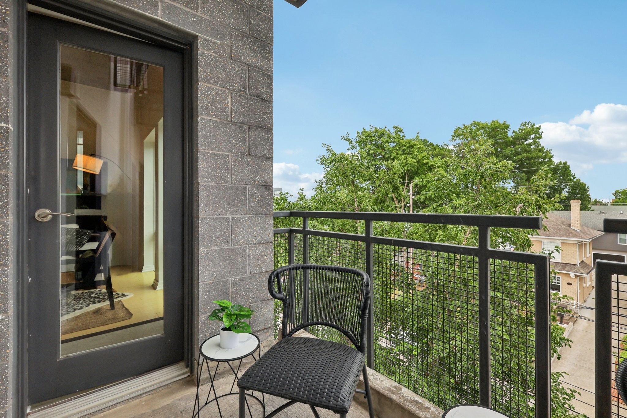 1101 18th Avenue South, Unit 401 Nashville, TN 37212 - Photo 16 of 17 a view of a balcony with chairs and a table