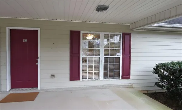 a view of a door and a window