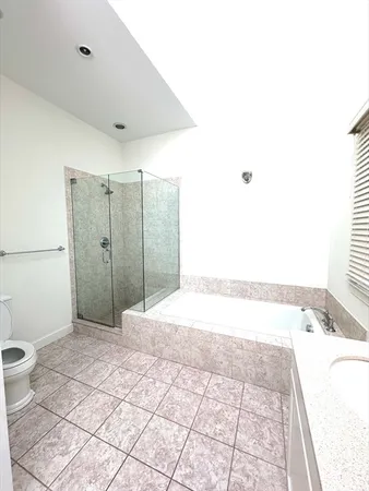 a bathroom with a bathtub and a shower