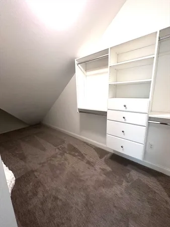 a view of an empty walk in closet