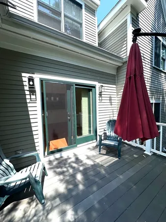 a view of a two chairs in the balcony