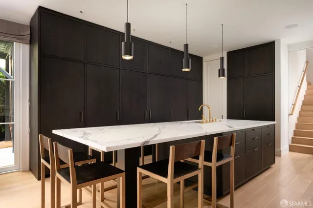 a view of a dining table chairs and a table
