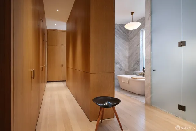 a bathroom with a bathtub and a sink