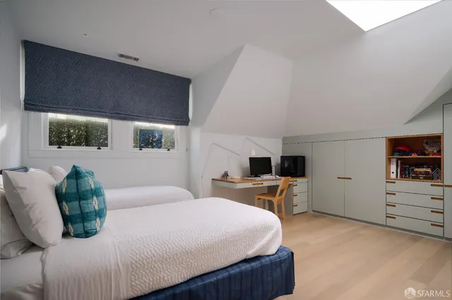 a bedroom with a bed and furniture