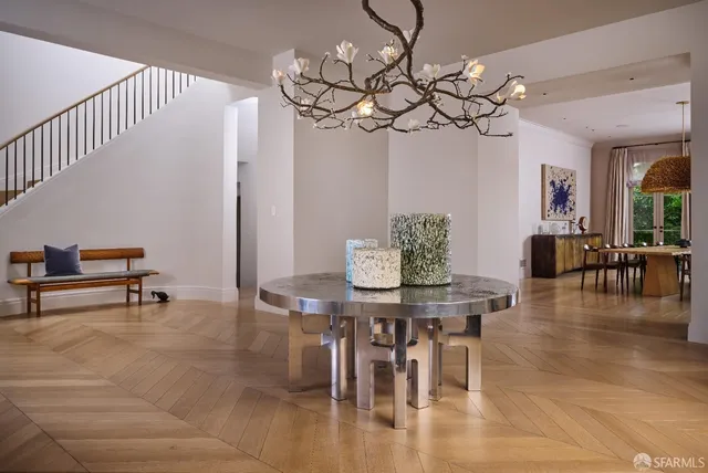 a view of a dining room with furniture window and wooden floor