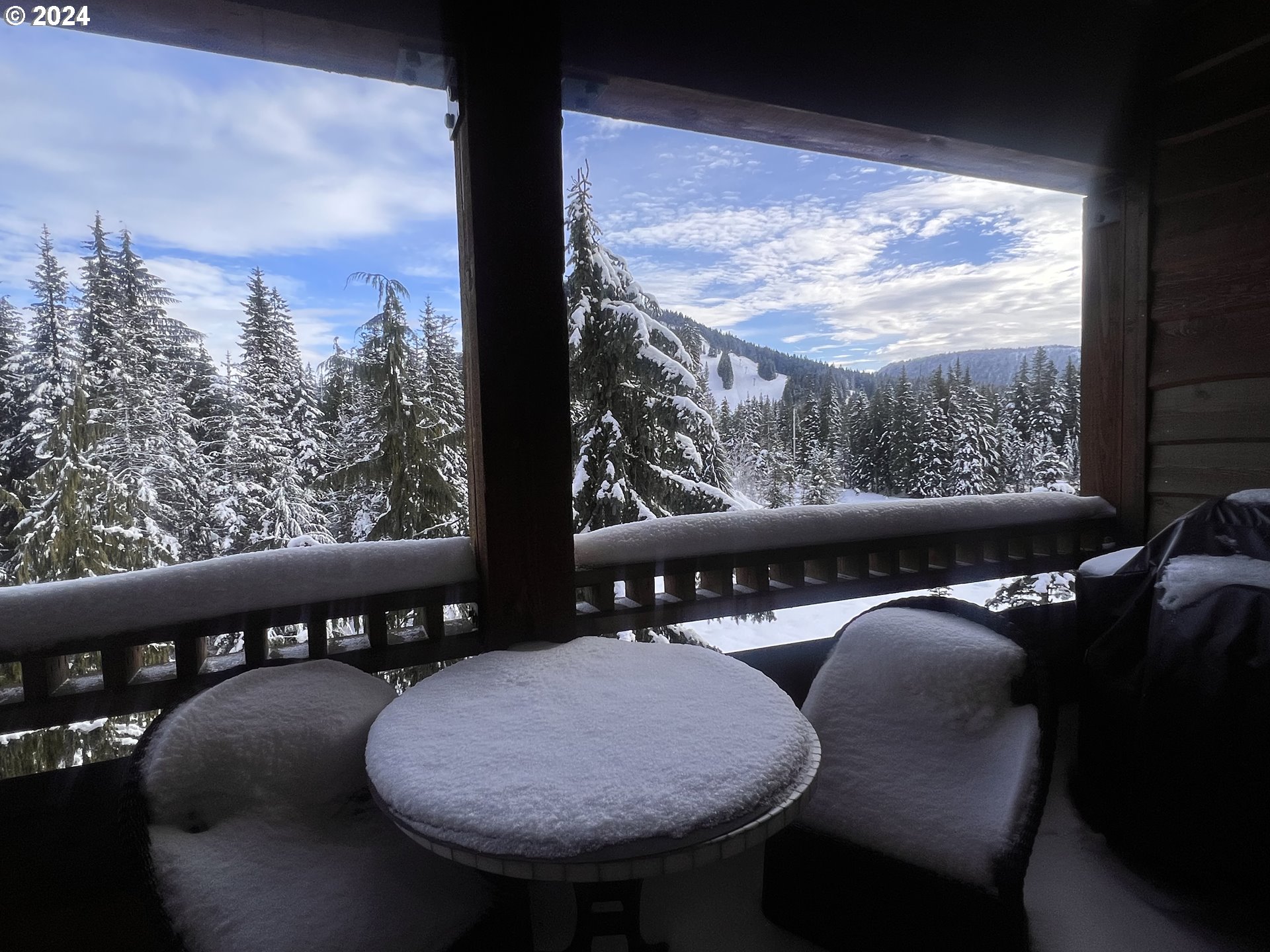 a view of a balcony with furniture