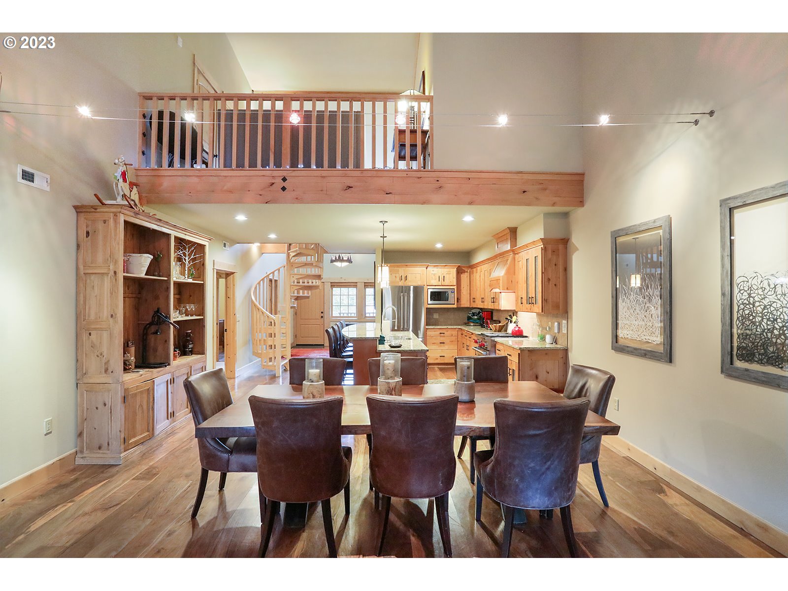 31226 East Collins Lake Road, Unit 27 Government Camp, OR 97028 - Photo 13 of 48 a dining room with furniture a window and wooden floor