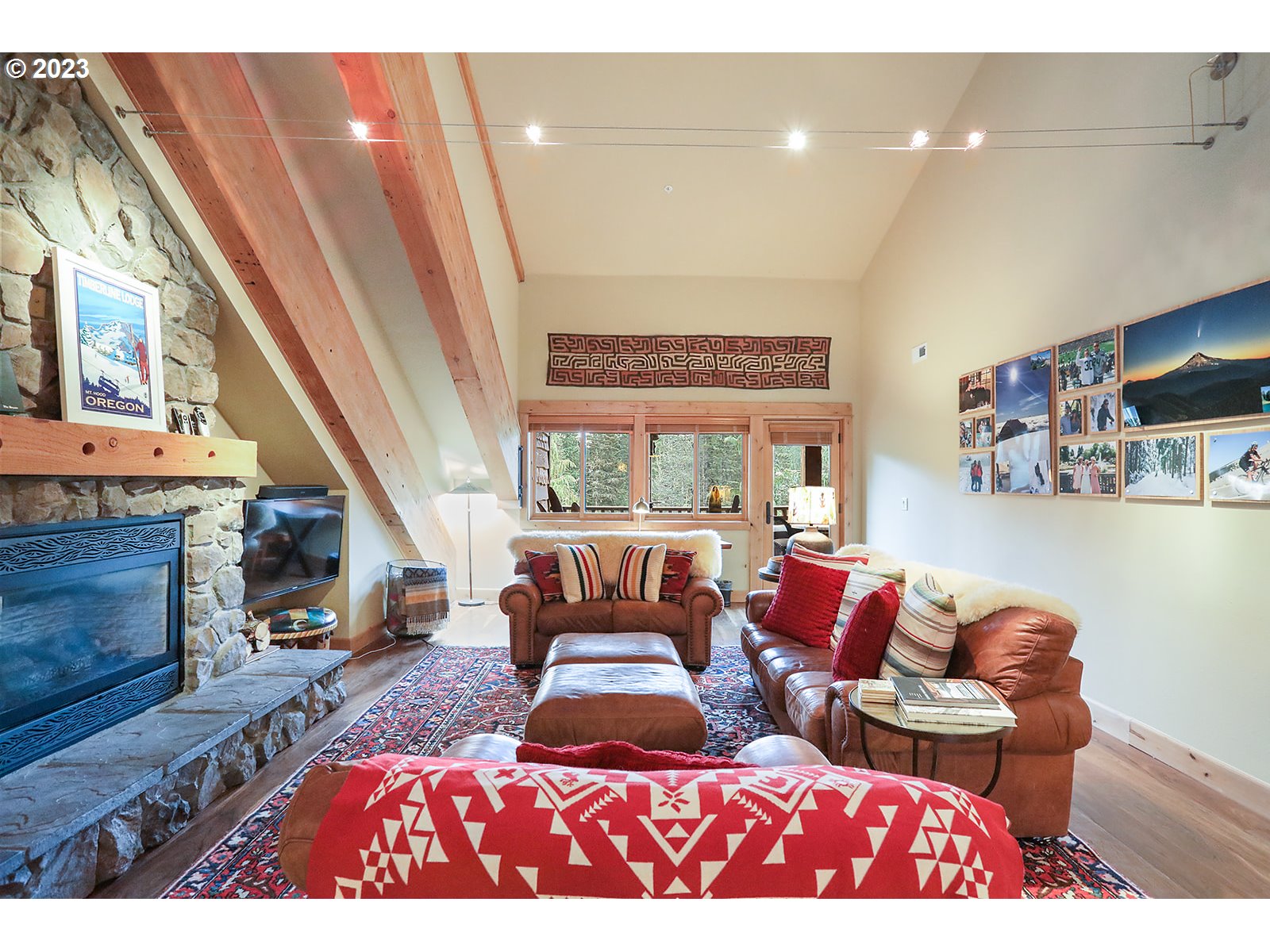 31226 East Collins Lake Road, Unit 27 Government Camp, OR 97028 - Photo 14 of 48 a living room with furniture and a fireplace