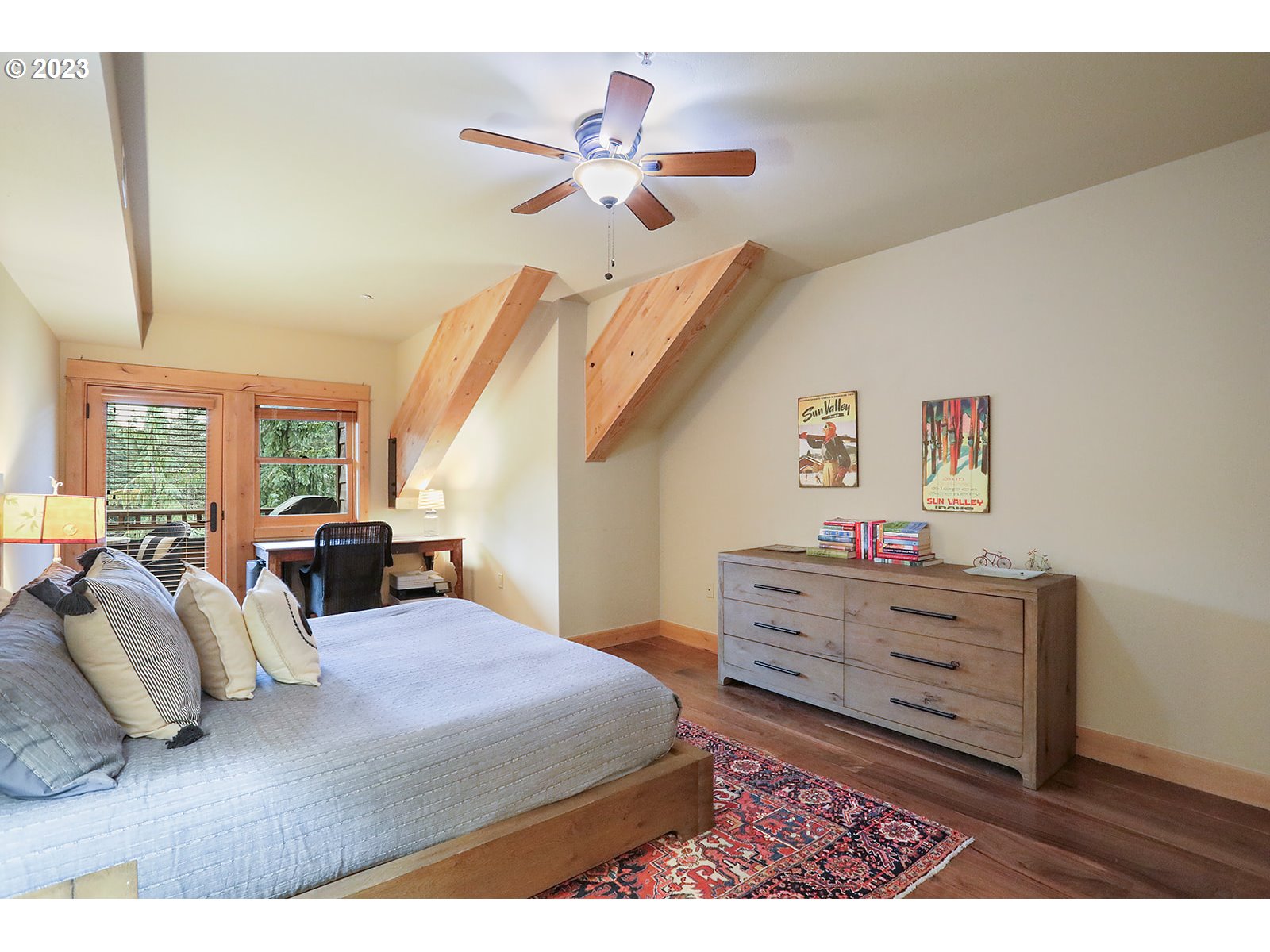 31226 East Collins Lake Road, Unit 27 Government Camp, OR 97028 - Photo 17 of 48 a bed room with a bed and a chandelier
