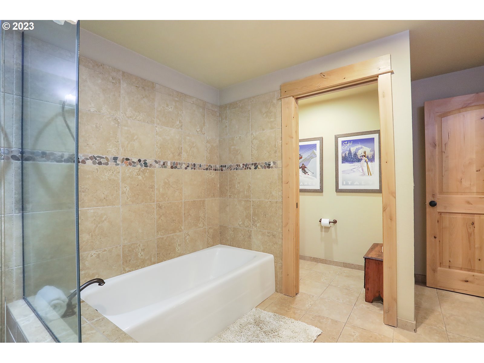 31226 East Collins Lake Road, Unit 27 Government Camp, OR 97028 - Photo 22 of 48 a bathroom with a bathtub a shower and a sink