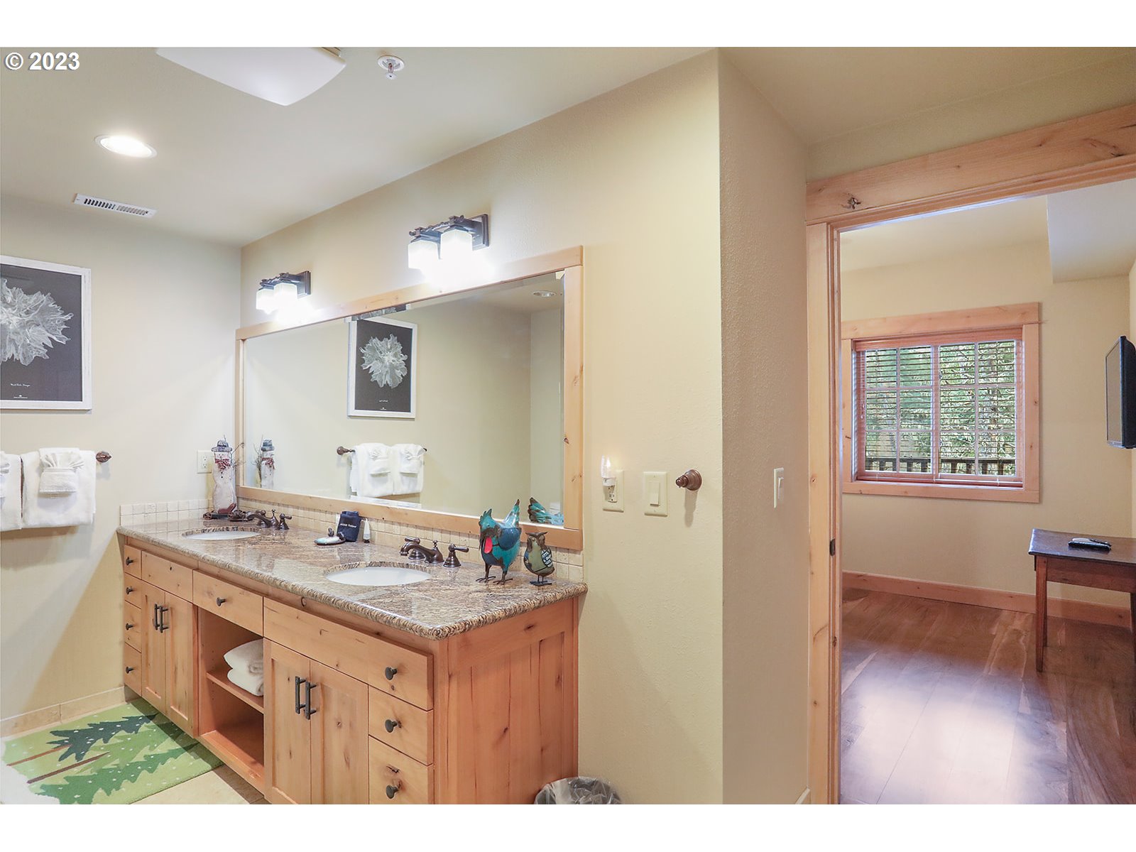 31226 East Collins Lake Road, Unit 27 Government Camp, OR 97028 - Photo 26 of 48 a bathroom with a granite countertop sink and a mirror