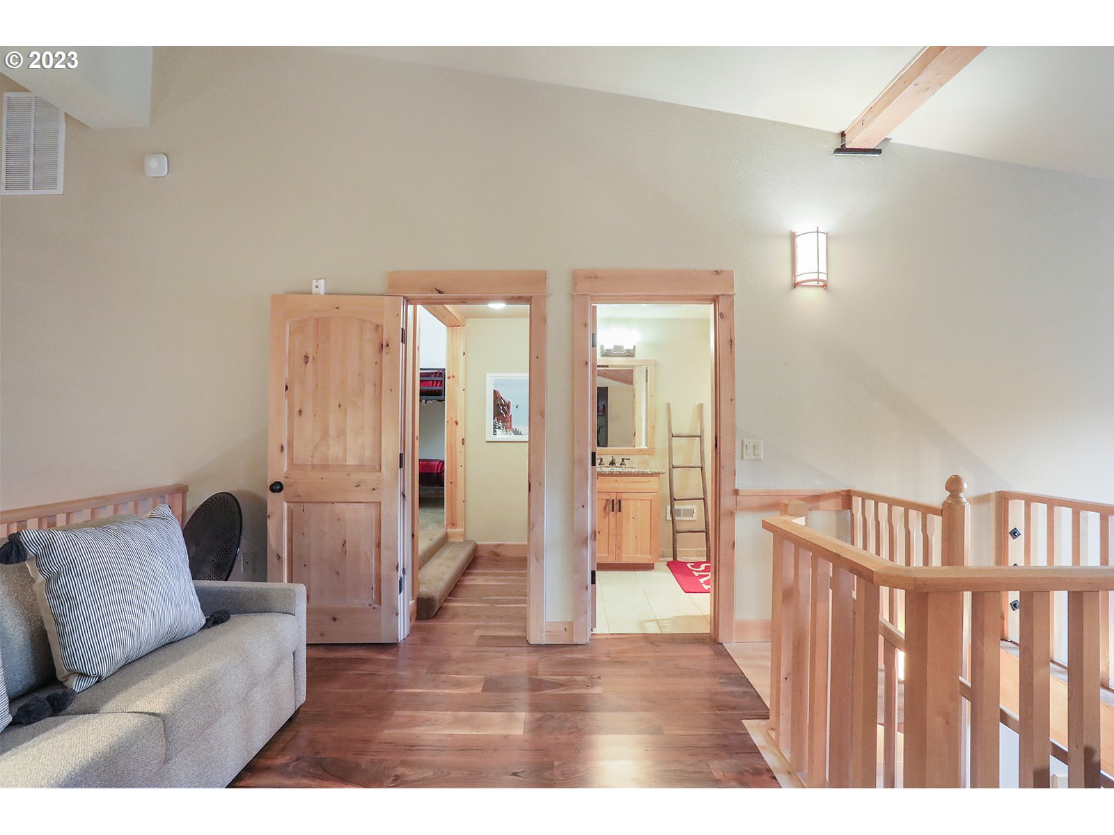 31226 East Collins Lake Road, Unit 27 Government Camp, OR 97028 - Photo 33 of 48 a living room with furniture and a wooden floor