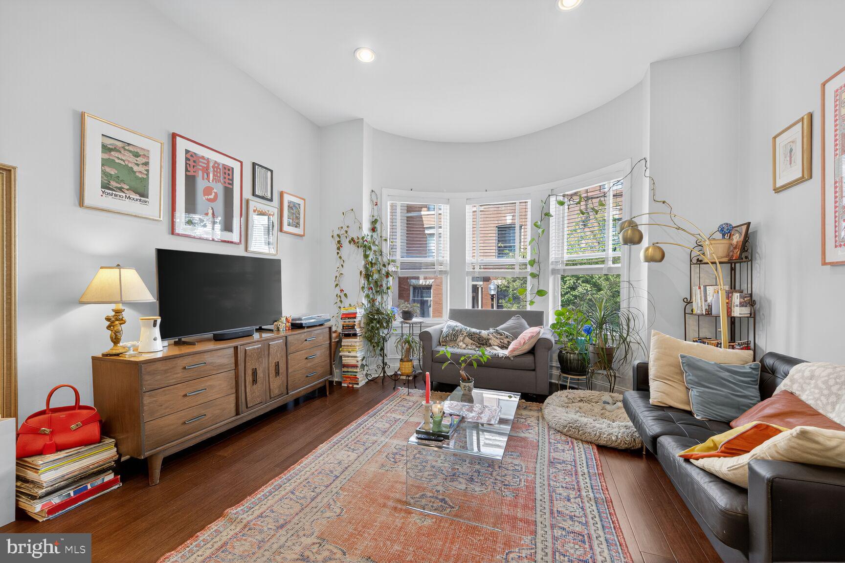 1409 Hopkins Street Northwest Washington, DC 20036 - Photo 12 of 44 a living room with furniture and a flat screen tv