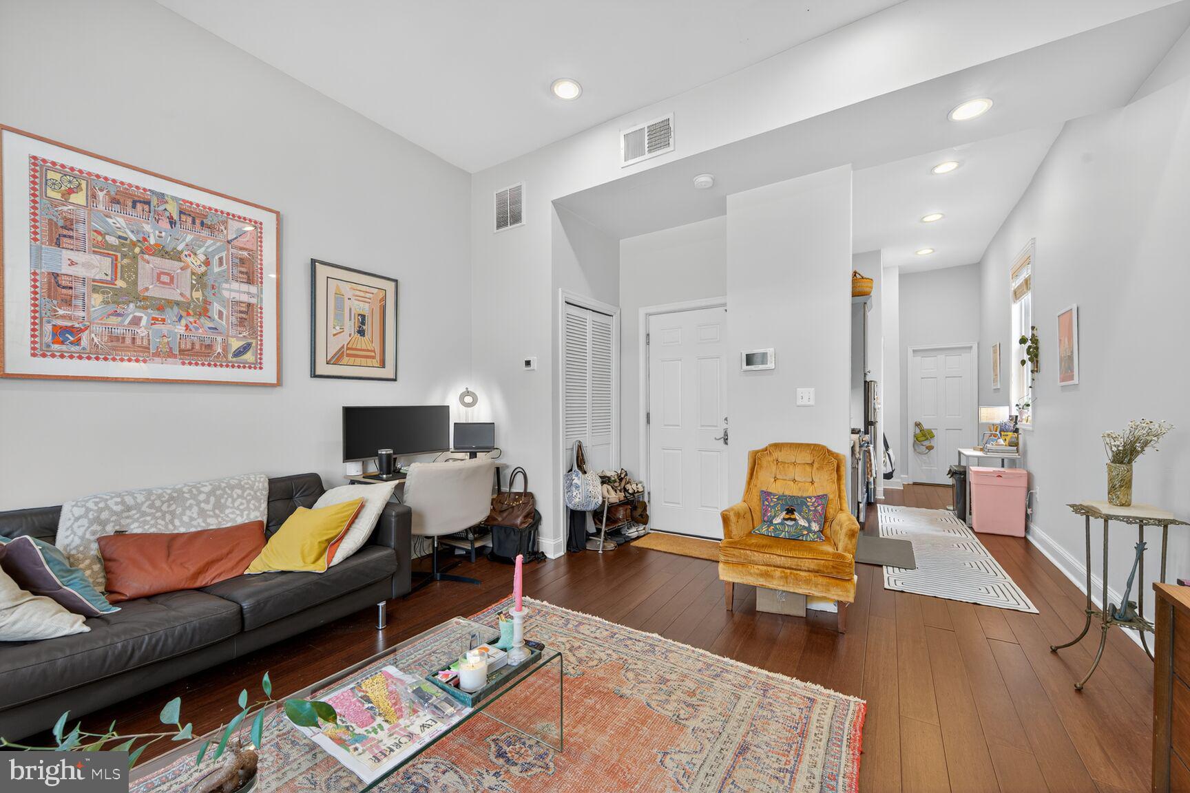 1409 Hopkins Street Northwest Washington, DC 20036 - Photo 13 of 44 a living room with furniture and a wooden floor