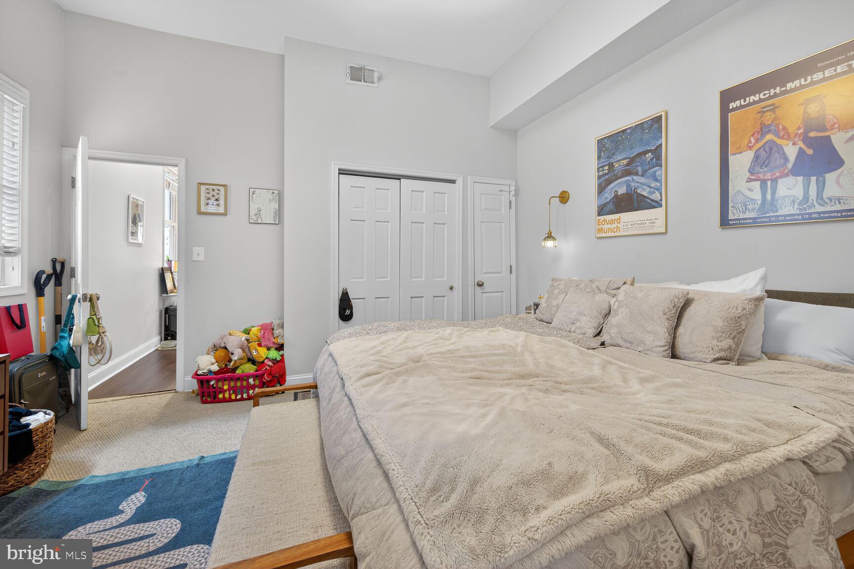 1409 Hopkins Street Northwest Washington, DC 20036 - Photo 18 of 44 a bedroom with a bed and a couch