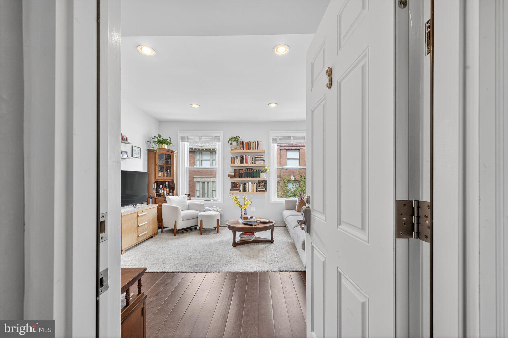 1409 Hopkins Street Northwest Washington, DC 20036 - Photo 19 of 44 a living room with furniture and large window