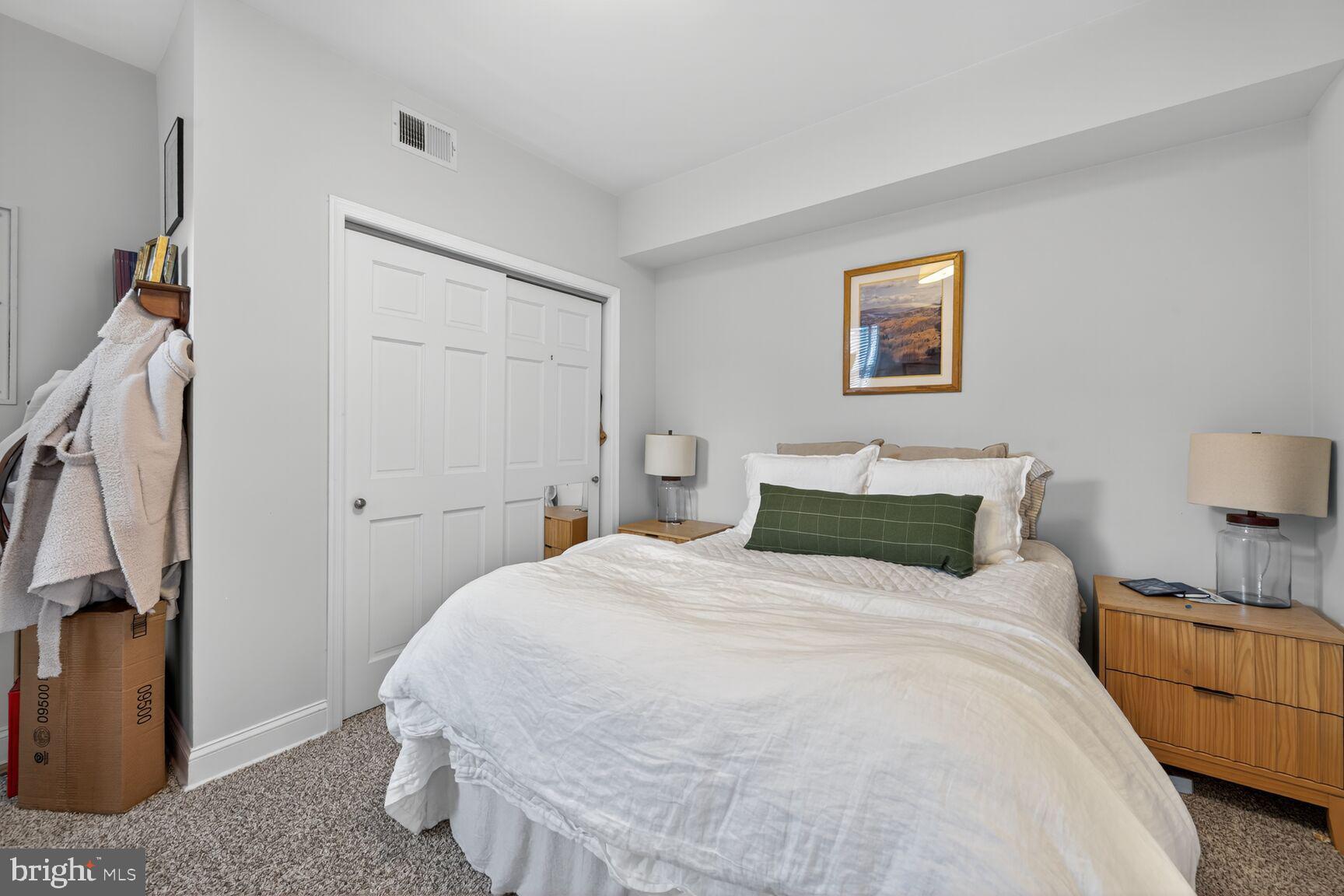 1409 Hopkins Street Northwest Washington, DC 20036 - Photo 26 of 44 a bedroom with a bed and a lamp
