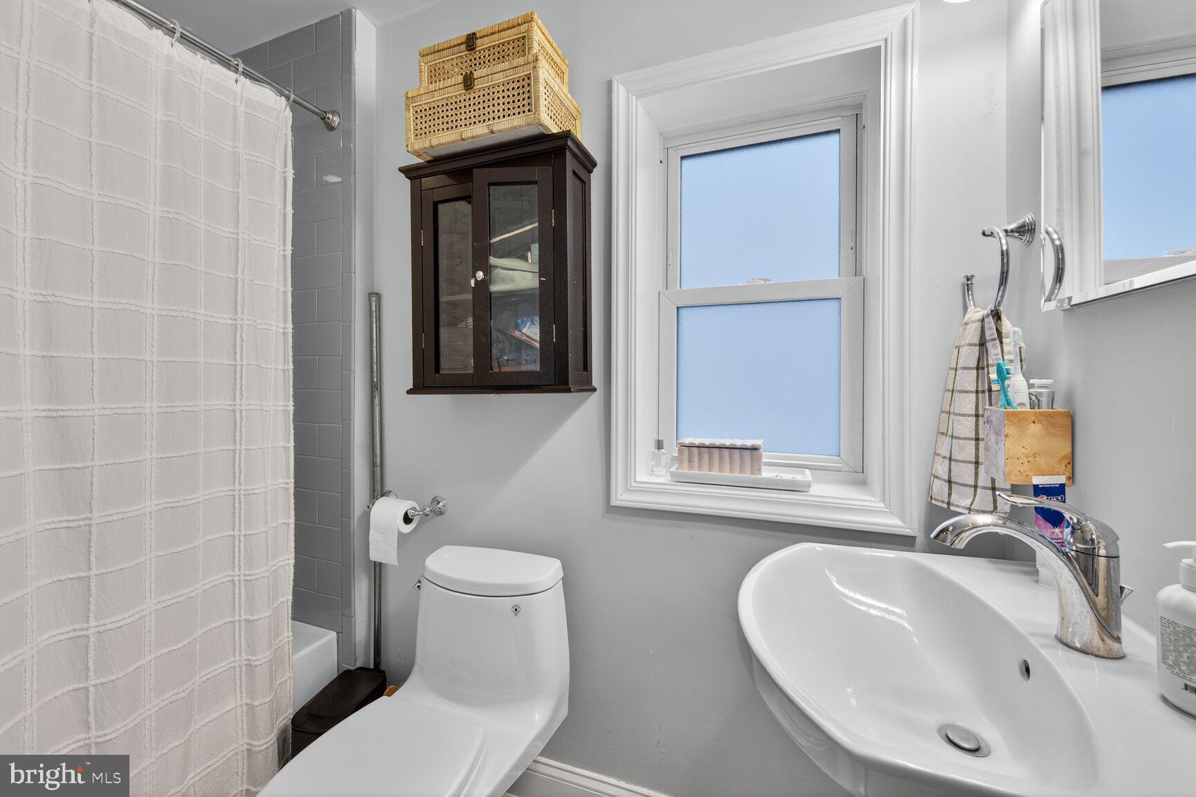 1409 Hopkins Street Northwest Washington, DC 20036 - Photo 27 of 44 a bathroom with a sink and a toilet