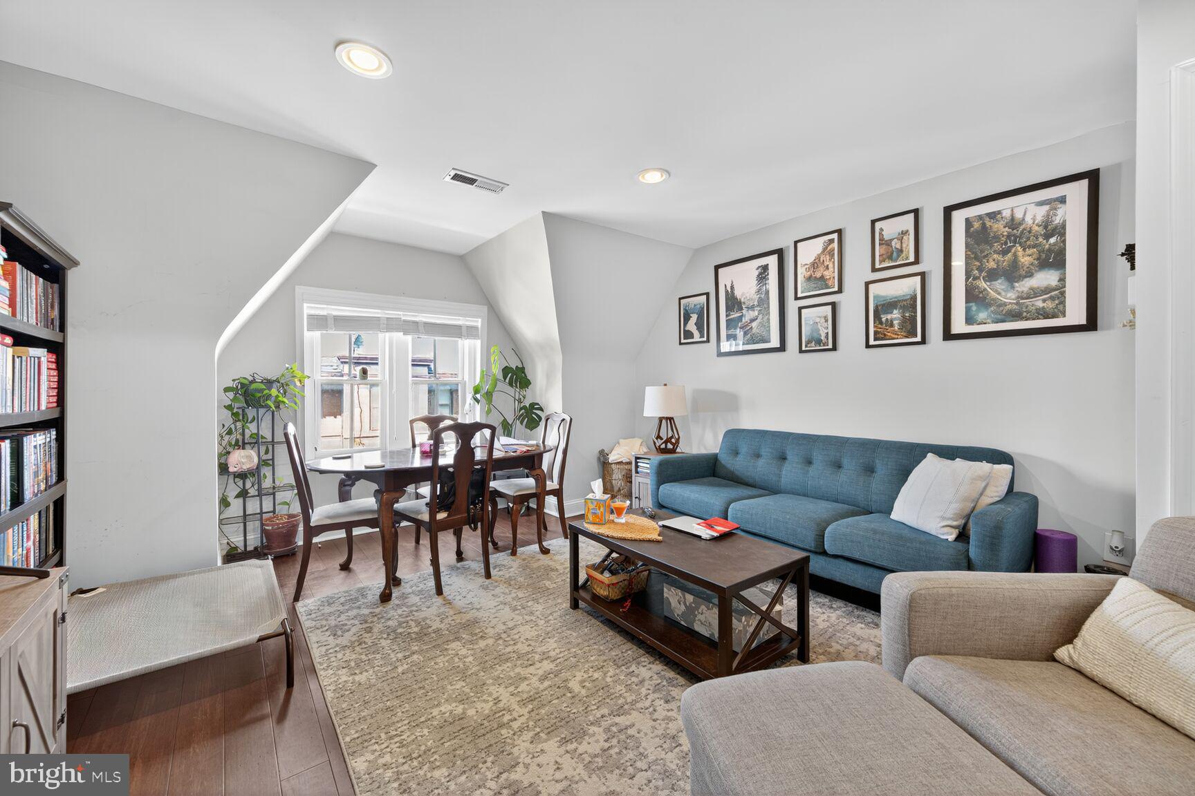 1409 Hopkins Street Northwest Washington, DC 20036 - Photo 32 of 44 a living room with furniture dining area and a table