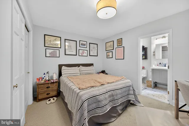 a bed room with a bed and a television