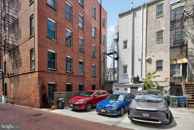 a car parked in front of a buildings