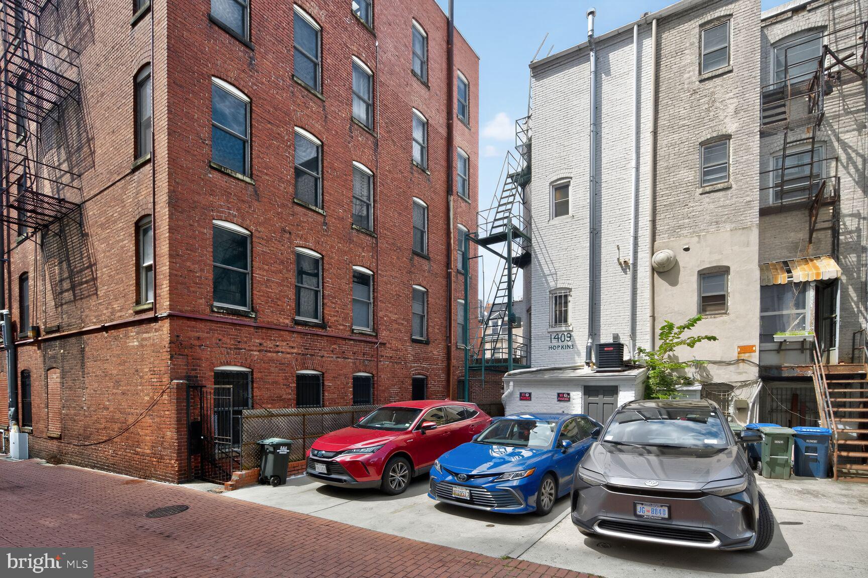 1409 Hopkins Street Northwest Washington, DC 20036 - Photo 38 of 44 a car parked in front of a brick building