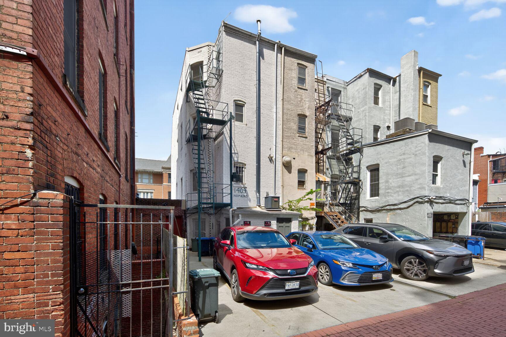 1409 Hopkins Street Northwest Washington, DC 20036 - Photo 39 of 44 a car parked in front of a buildings