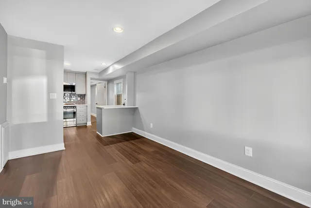 a kitchen with stainless steel appliances a refrigerator sink and cabinets