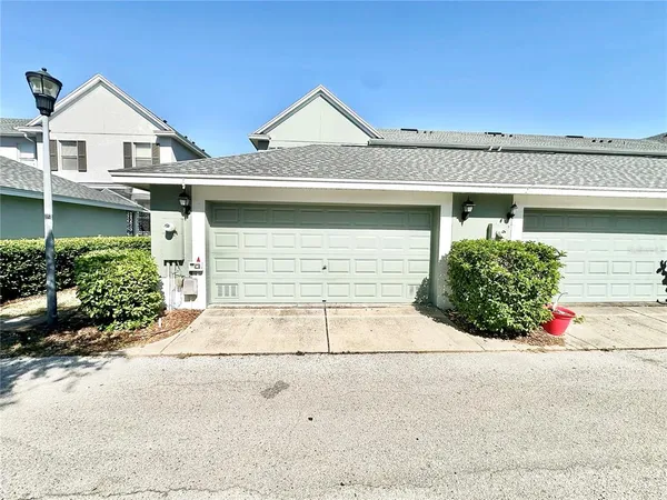 a front view of a house with garage