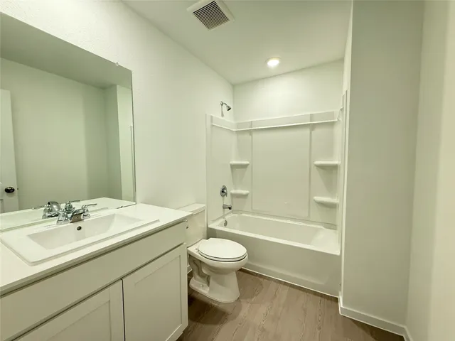 a view of an empty room and a window